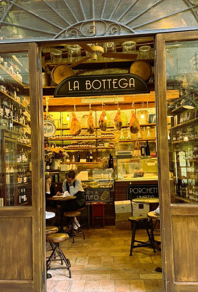 Cured meats and wines inside La Bottega di Spoleto food shop