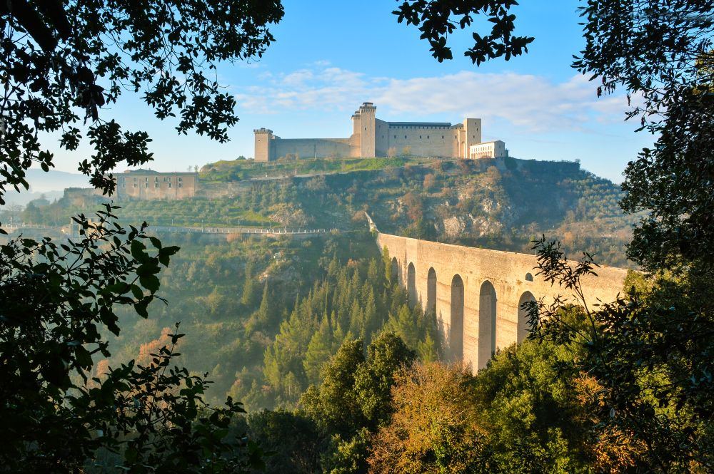 The Rocca Albornoziana above Spoleto with the Ponte delle Torri spanning the wooded gorge